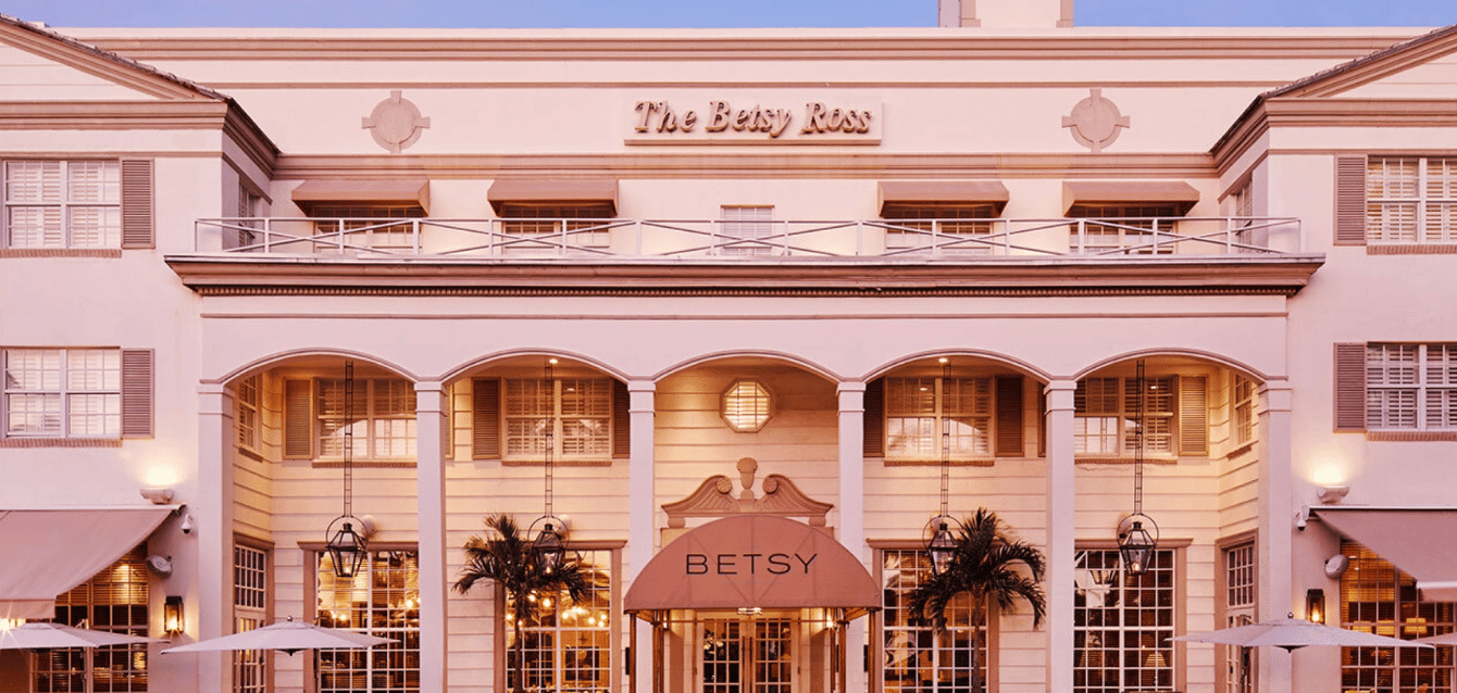 The Betsy Hotel's elegant exterior in Miami, featuring classic architecture and a warm, inviting entrance—showcasing WaveBNB’s direct booking website optimization and SEO strategy to reduce OTA re The Betsy Hotel's elegant exterior in Miami, featuring classic architecture and a warm, inviting entrance—showcasing WaveBNB’s direct booking website optimization and SEO strategy to reduce OTA re